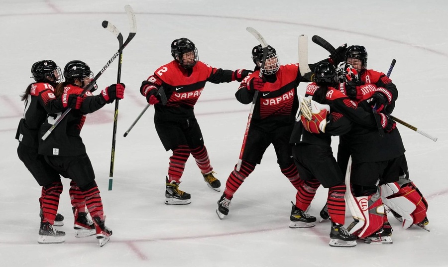 Japan players celebrate after beating the Czech Republic in a penalty shootout on Tuesday, February 8 to top Group B. (Photo: AP/Petr David Josek).