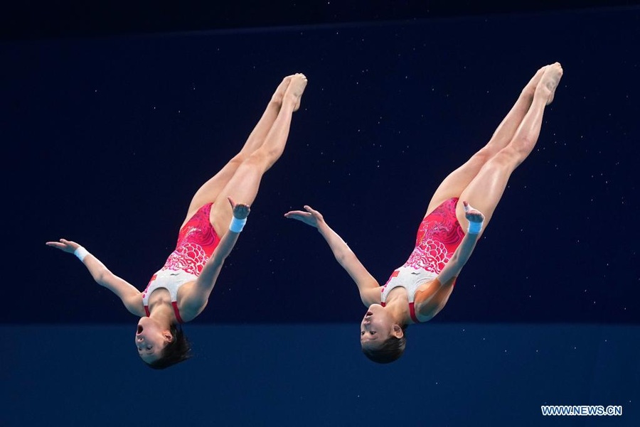 China’s Chen Yuxi and Zhang Jiaqi compete in the women's synchronised 10m platform final at Tokyo 2020 on Tuesday, July 27. © Xinhua/Xu Chang