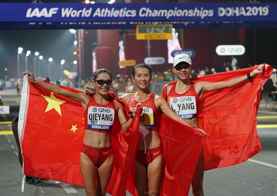 A file photo taken on September 30, 2019 shows gold medalist Liu Hong (centre), silver medalist Qieyang Shijie (left) and bronze medalist Yang Liujing after the women's 20km race walk during the 2019 IAAF World Athletics Championships in Doha. © Xinhua/Xu