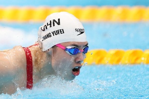 Chinese swimmer Zhang sets Olympic, world records in golden double