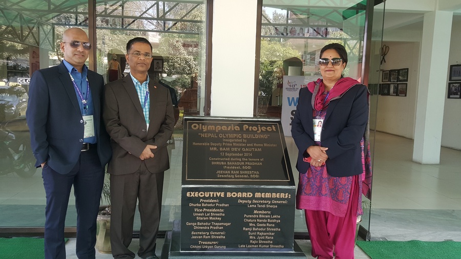 Sujan Shrestha (left), Executive Secretary of Nepal NOC, Nayaf Sraj, OCA Financial Officer, and Jyoti Rana, Vice President of Nepal NOC, flank the plaque commemorating the Nepal Olympic Building.