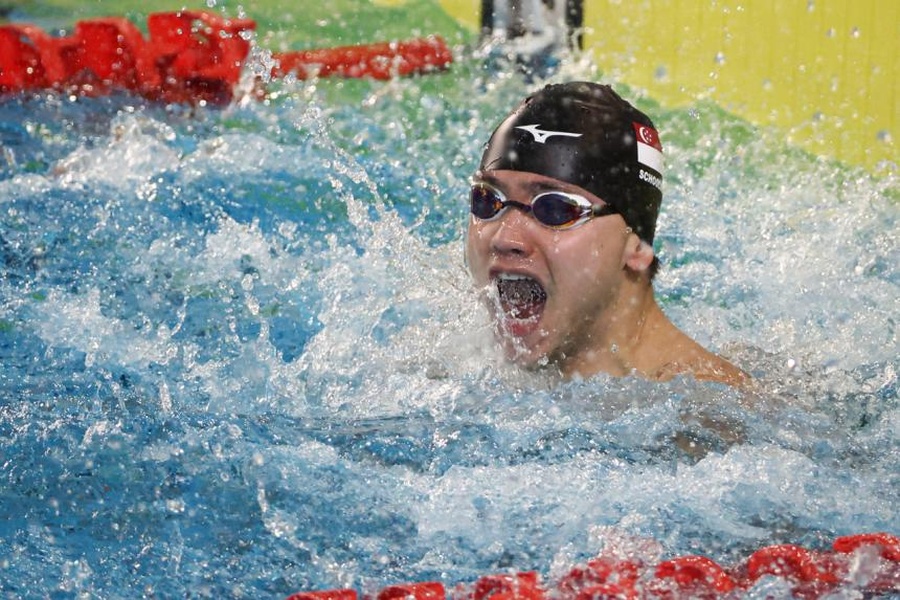 Joseph Schooling celebrating after winning the men's 100m butterfly in the Hanoi SEA Games on May 16, 2022. © Lianhe Zaobao/The Straits Times