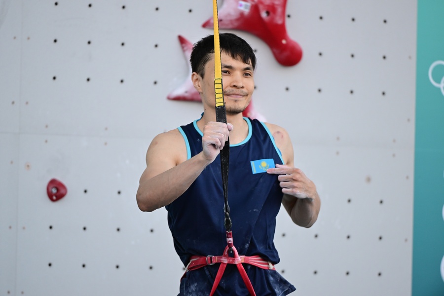 Speed climber Amir Maimuratov reaches for the top