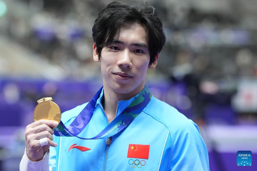 China’s Zhang fends off Japanese rivals to defend gymnastics all-around title