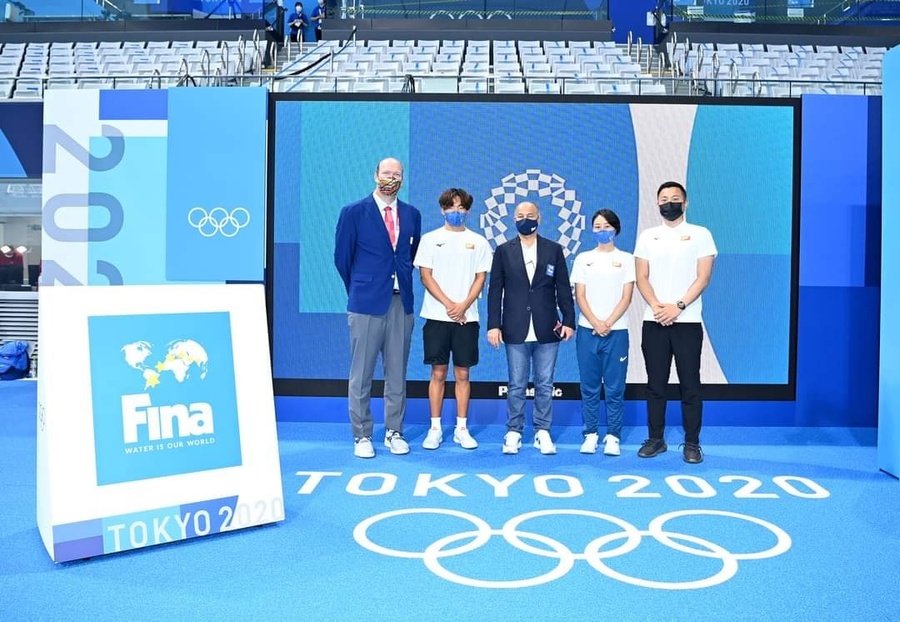 Team Bhutan with FINA President Husain Al-Musallam at the Tokyo Aquatics Centre. © Bhutan Olympic Committee