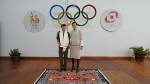 Bhutan NOC President Prince Jigyel congratulates boxer Kinley Phuntsho