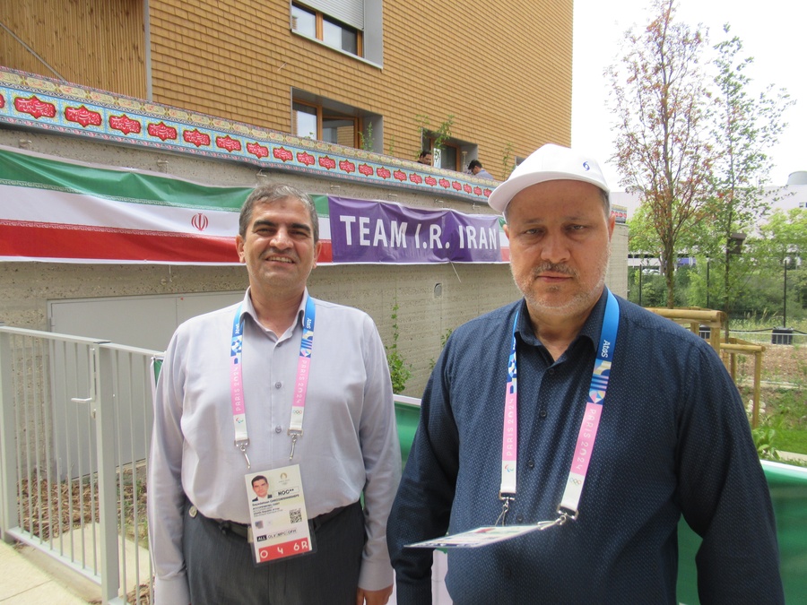 Dr. Seyed Manaf Hashemi (right) and accompanying guest Seyedehsan Ghazizdadeh Hashemi outside the Iran NOC HQ in the Paris Olympic Village (Photo: OCA)