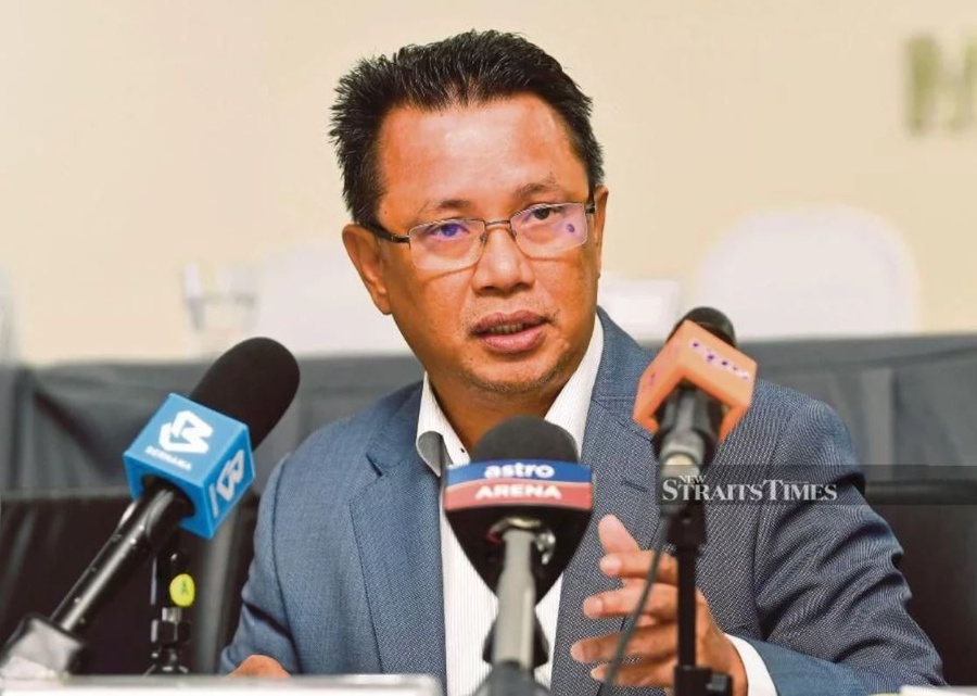 OCM President Datuk Seri Norza Zakaria speaks to reporters after the OCM Executive Council meeting on March 7. © BERNAMA