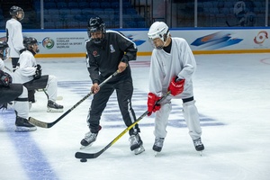 Vietnamese Ha Bao Nguyen displays funky moves at ice hockey youth camp