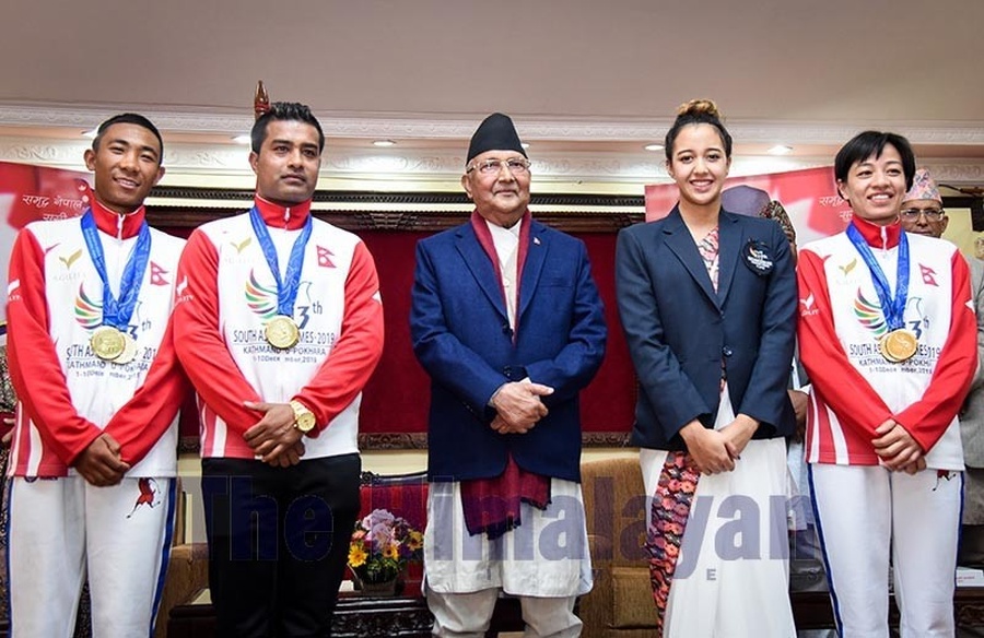 Nepal Prime Minister KP Sharma Oli flanked by (from left) golfer Subash Tamang, karateka Manday Kaji Shrestha, swimmer Gaurika Singh and taekwondos Ayasha Shakya. © The Himalayan Times