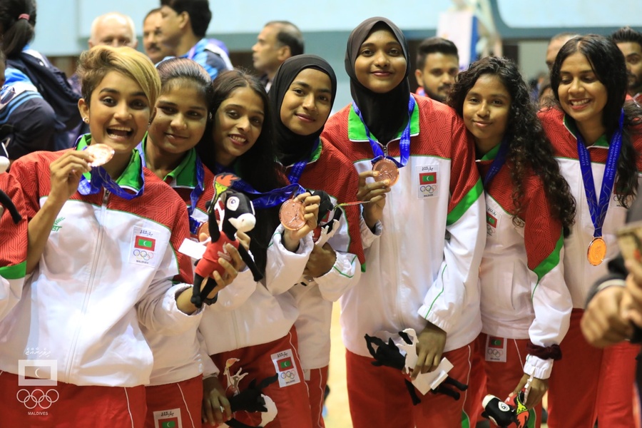 Happier days: Maldives women's basketball team after winning the bronze medal at 2019 South Asian Games in Nepal. © Maldives Olympic Committee