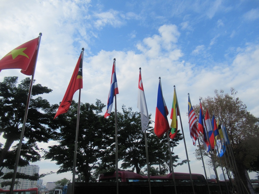 The flags of the 11 NOCs competing in the SEA Games are on display outside the Hyatt Regency West Hanoi – official headquarters hotel. © OCA.