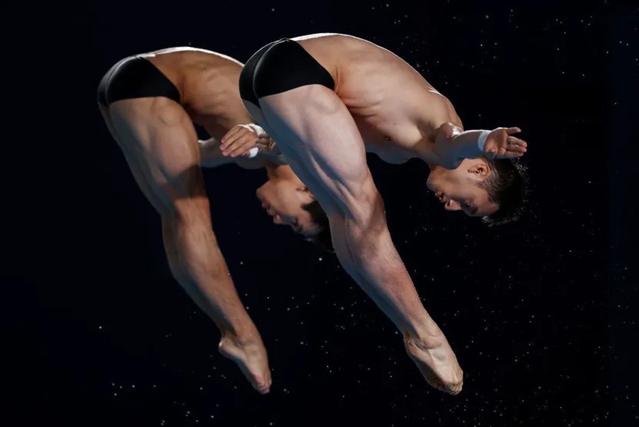 Lian Junjie and Yang Hao perform in the men’s 10m synchro at Hamad Aquatic Centre on Thursday. It was China's 12th gold medal of Doha 2024 and seventh in diving. (Photo: Getty Images)