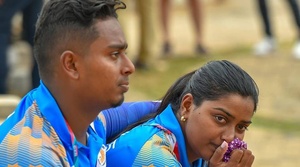 Social distancing at low-key wedding for Indian archers