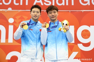 Wang, Zheng show class to claim gold for China