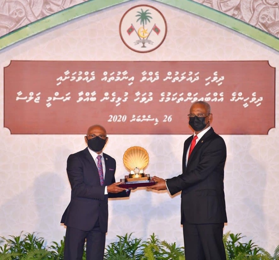 MOC Vice President Ahmed Latheef receiving his award from President Solih.