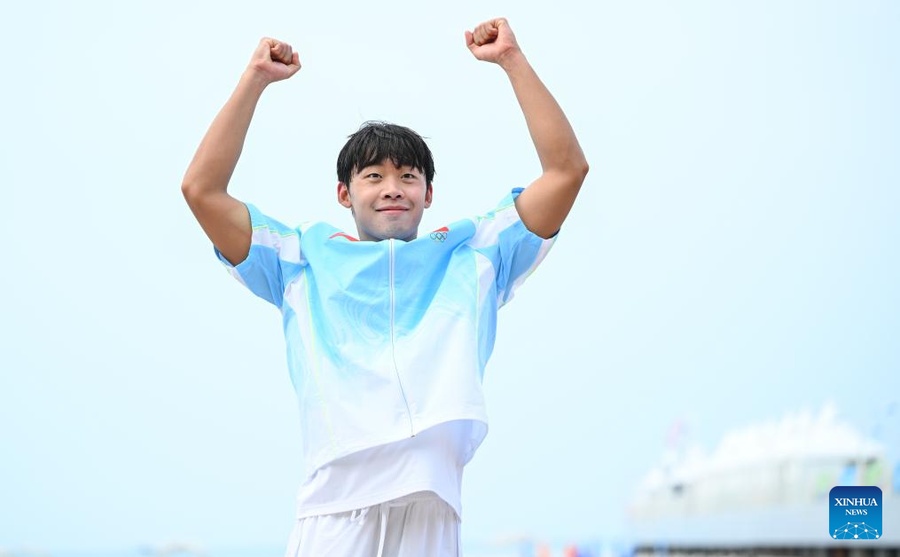 Zhang Ziyang celebrates gold in the men's 5km open water swimming competition at the 6th Asian Beach Games in Sanya, China on Sunday, April 26. (Photo: Xinhua)