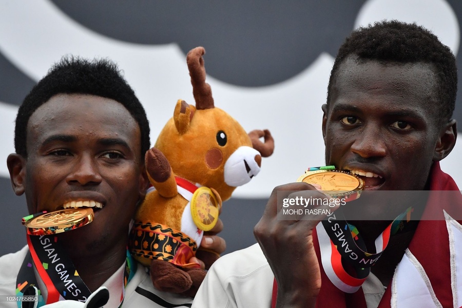 Cherif Younousse and Ahmed Tijan celebrate with their 2018 Asian Games gold medals. © Getty Images