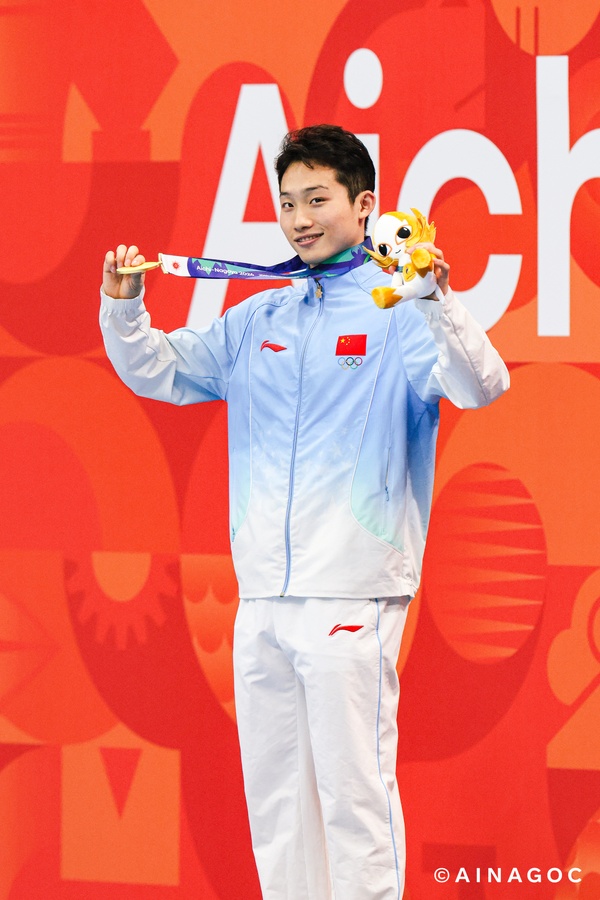 Determined Wang dives to golden hat-trick at Aichi-Nagoya 2026