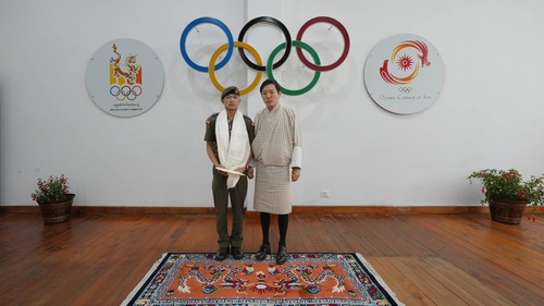 Bhutan NOC President Prince Jigyel congratulates boxer Kinley Phuntsho