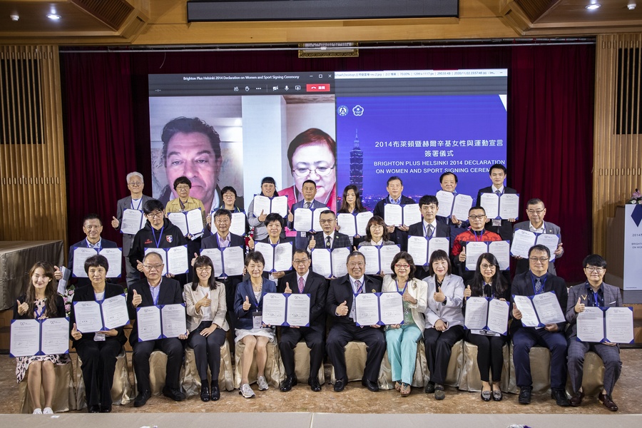 Group photo of all the signatories with the witnesses for the signing ceremony.