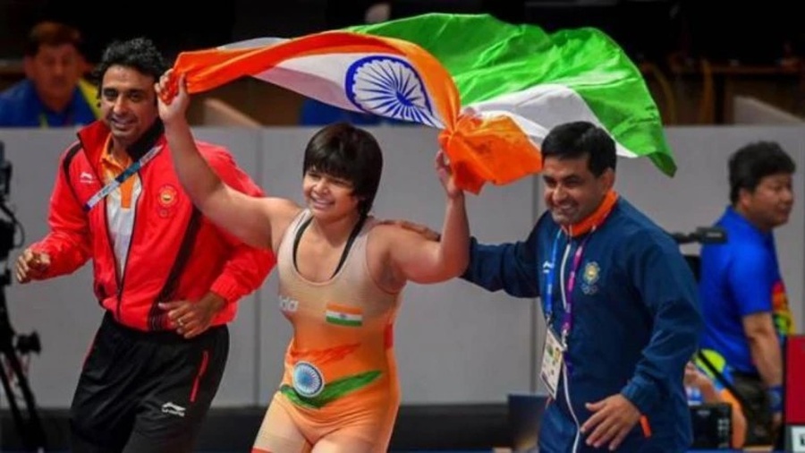 India's Divya Kakran celebrates after winning a gold medal at the Asian Wrestling Championships in New Delhi. © PTI