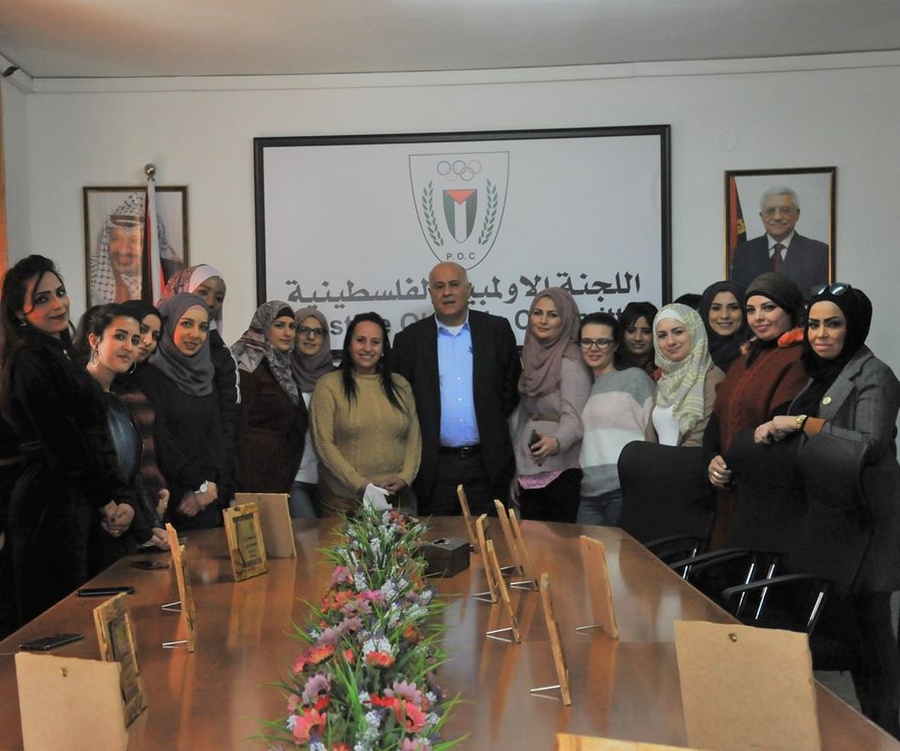 Palestine Olympic Committee President Gen. Jibril Rajoub with female members of staff to mark International Women’s Day. © POC Facebook