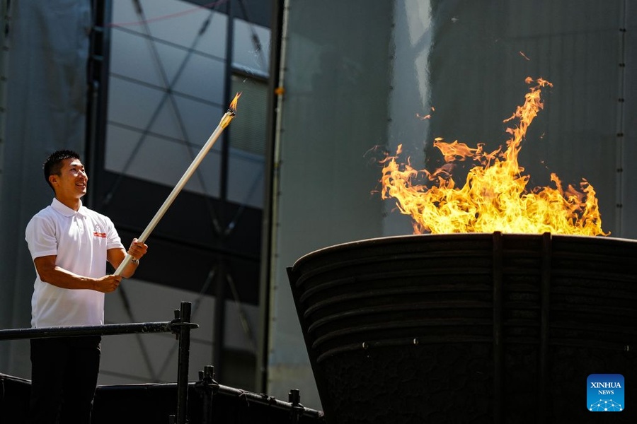 Japanese sprinter Yoshihide Kiryu is pictured at the flame lighting ceremony Tokyo on Tuesday. (Photo: Xinhua/Jia Haocheng)