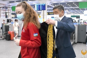 Top Uzbekistan NOC officials welcome home taekwondo heroes