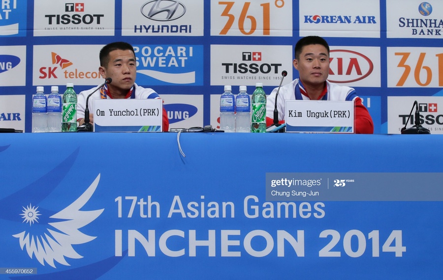 Om Yun Chol (left) is the star student of celebrated weightlifting coach Ro Hyon Chol. © Getty Images
