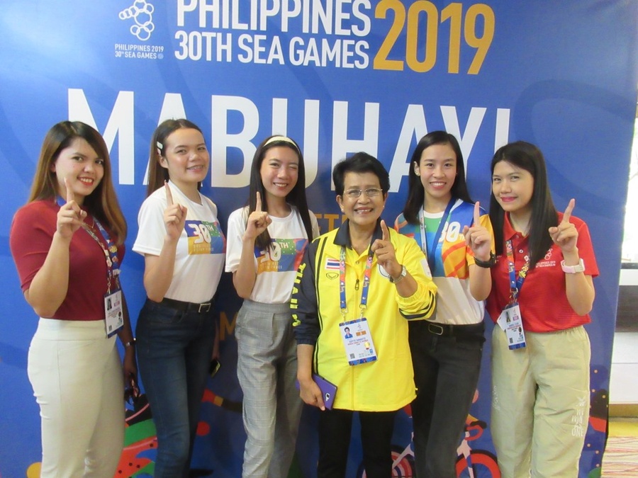 Prof. Dr Supitr Samahito with assistants from the organising committee at the Quest Hotel in Clark – NOC HQ for the 30th SEA Games. "We win as one" is the slogan of the games.