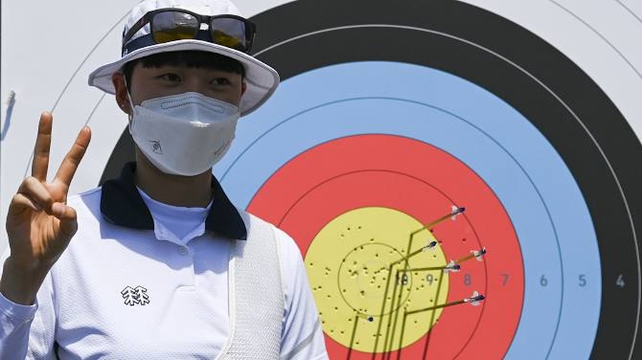 An San of Korea gestures after setting a new Olympic record of 680 in women’s archery on Friday, July 23. The Korean pair were much too strong for Bangladesh in the mixed team event on Saturday. © Reuters/Clodagh Kilcoyne