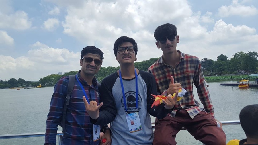 Noorzai Ibrahimi (left) bonds with fellow skateboarders at the OCA youth camp in Nanjing, China in 2019. © Ujwol Dangol