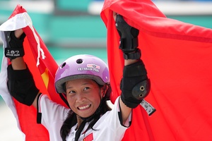 Street-wise Chinese teens ride to skateboarding golden double