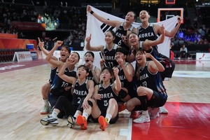 Korean women survive furious Japan rally to join men as basketball champions