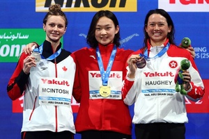 Li wins gold for China, Haughey makes history with third medal