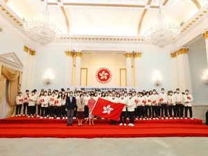 Hong Kong Chief Executive Carrie Lam hands SAR flag to Olympic delegation