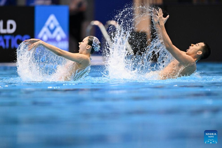 Shi Haoyu (right) and Cheng Wentao of China compete during the mixed duet free final of artistic swimming at the World Aquatics Championships in Fukuoka, Japan, on July 22, 2023. (Photo: Xinhua/Xu Chang)